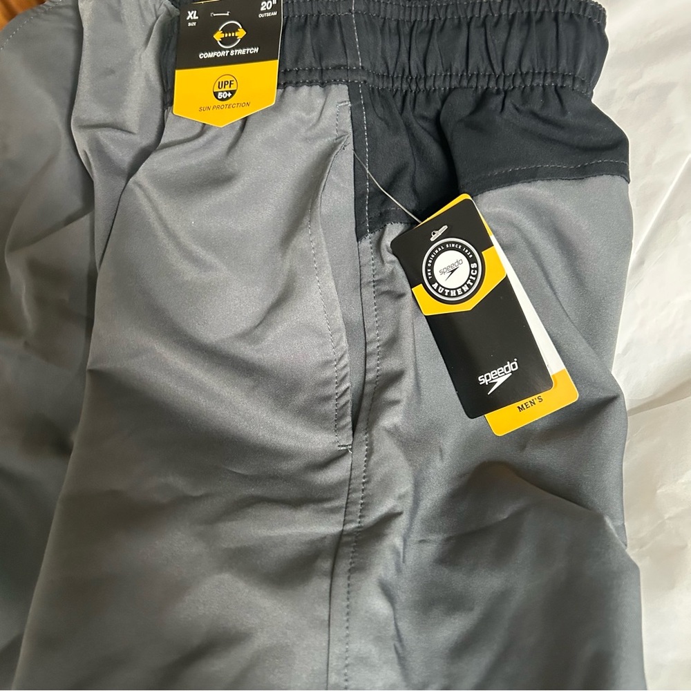 NWT - Speedo swim trunks - grey with black trim 20” out seam, mesh liner Size XL